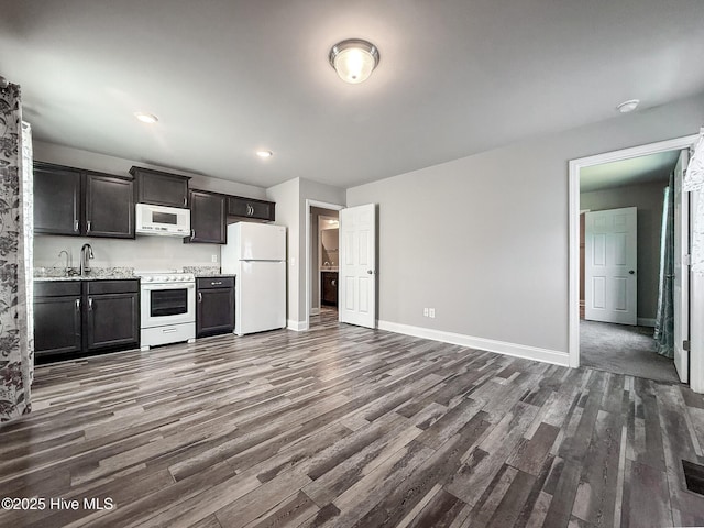 126 Vick Ave, Carthage, NC 28327 - kitchen with white appliances, dark wood-style floors, baseboards, and light countertops