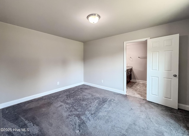 126 Vick Ave, Carthage, NC 28327 - unfurnished bedroom featuring dark carpet and baseboards