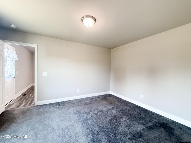 126 Vick Ave, Carthage, NC 28327 - unfurnished room featuring dark colored carpet and baseboards
