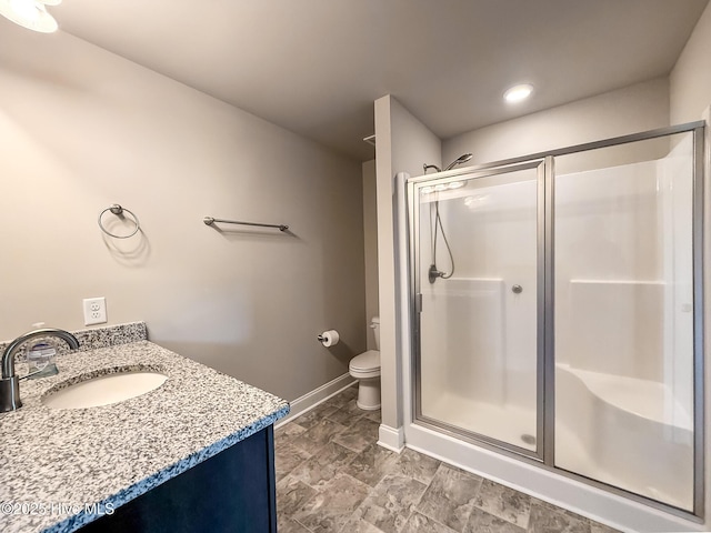126 Vick Ave, Carthage, NC 28327 - full bath featuring a shower stall, vanity, baseboards, and toilet