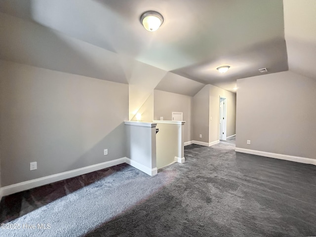126 Vick Ave, Carthage, NC 28327 - bonus room featuring vaulted ceiling, dark carpet, and baseboards