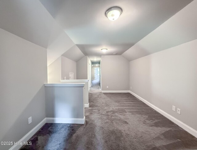 126 Vick Ave, Carthage, NC 28327 - bonus room with dark colored carpet, lofted ceiling, and baseboards