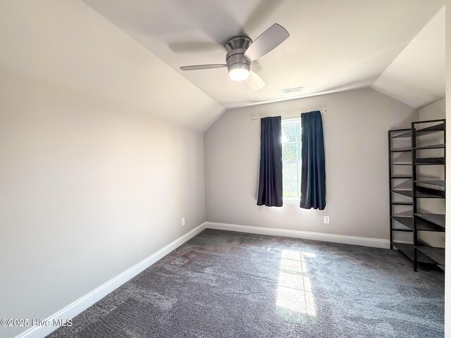 126 Vick Ave, Carthage, NC 28327 - additional living space with lofted ceiling, dark colored carpet, baseboards, and a ceiling fan