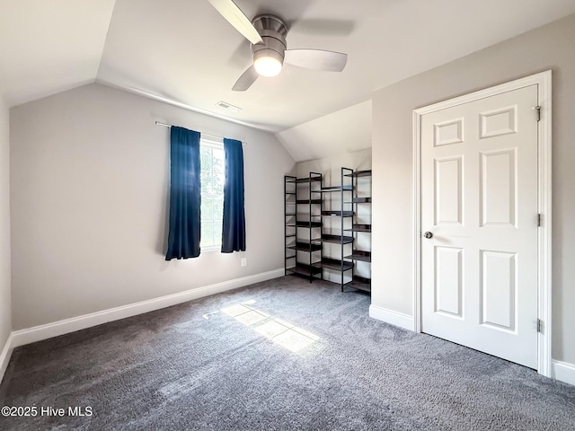 126 Vick Ave, Carthage, NC 28327 - unfurnished bedroom featuring vaulted ceiling, carpet, baseboards, and a ceiling fan