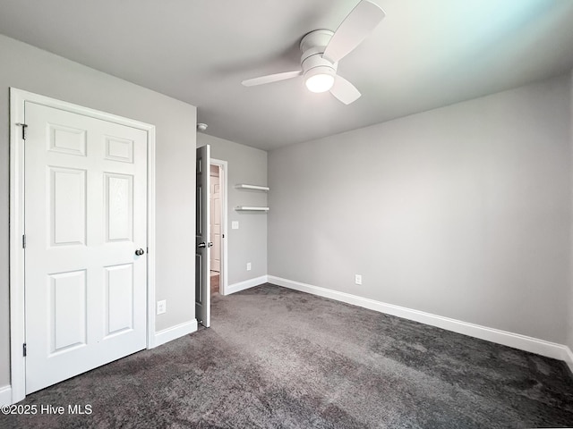 126 Vick Ave, Carthage, NC 28327 - unfurnished bedroom with baseboards, dark colored carpet, and a ceiling fan