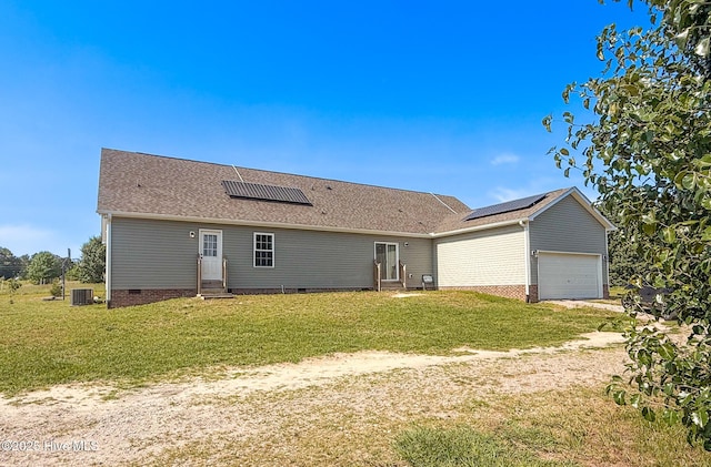 126 Vick Ave, Carthage, NC 28327 - view of front facade with entry steps, solar panels, crawl space, and a garage