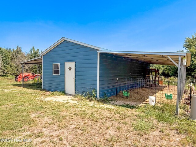 126 Vick Ave, Carthage, NC 28327 - view of pole building featuring a carport