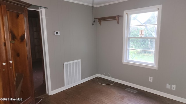 2720 Loop Rd, Loris, SC 29569 - unfurnished room with crown molding, baseboards, and dark wood-style flooring