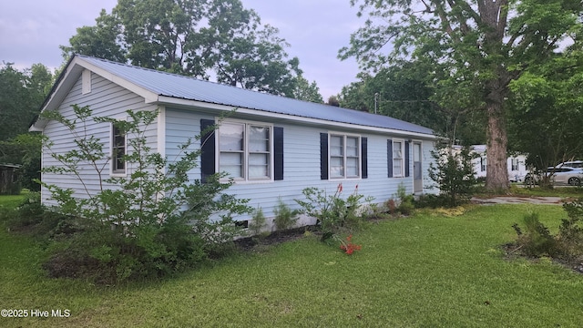 2720 Loop Rd, Loris, SC 29569 - view of side of property featuring a lawn and metal roof