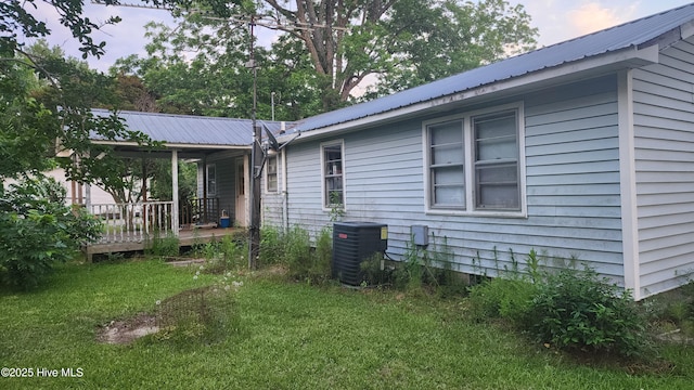 2720 Loop Rd, Loris, SC 29569 - rear view of property with central air condition unit, a yard, and metal roof