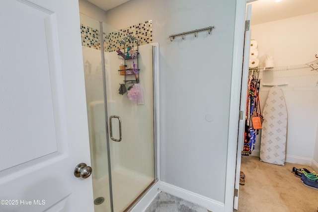 2003 Riverview Ln, Morehead City, NC 28557 - full bathroom featuring a stall shower and a spacious closet