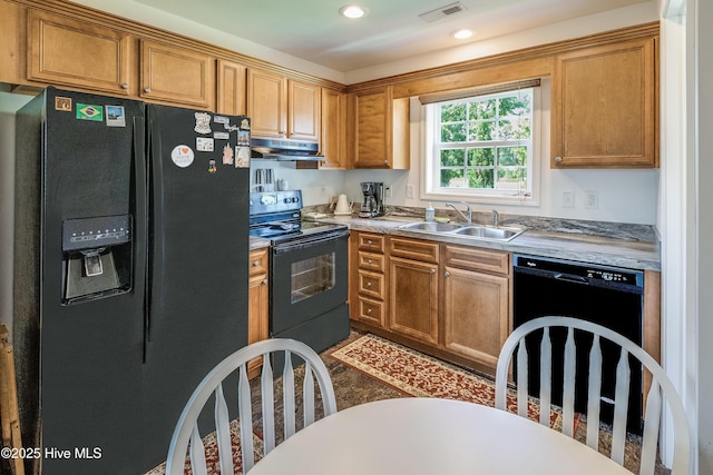 2003 Riverview Ln, Morehead City, NC 28557 - kitchen featuring black appliances, a sink, under cabinet range hood, light countertops, and recessed lighting