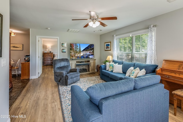 2003 Riverview Ln, Morehead City, NC 28557 - living area featuring a ceiling fan and wood finished floors