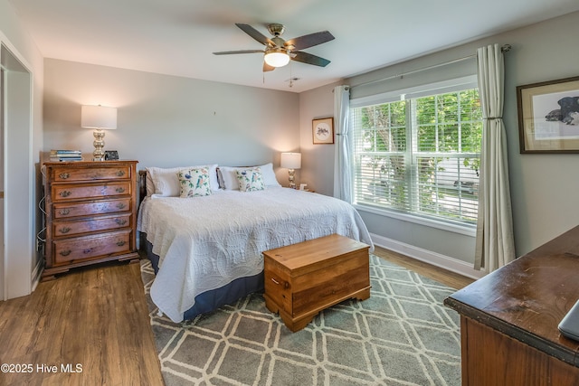 2003 Riverview Ln, Morehead City, NC 28557 - bedroom with wood finished floors, baseboards, and ceiling fan