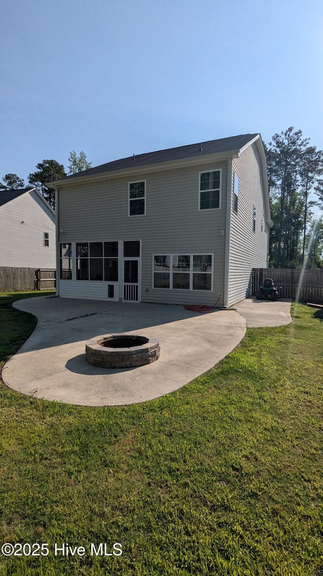 435 Lancaster Dr, Vass, NC 28394 - rear view of property featuring a patio and an outdoor fire pit