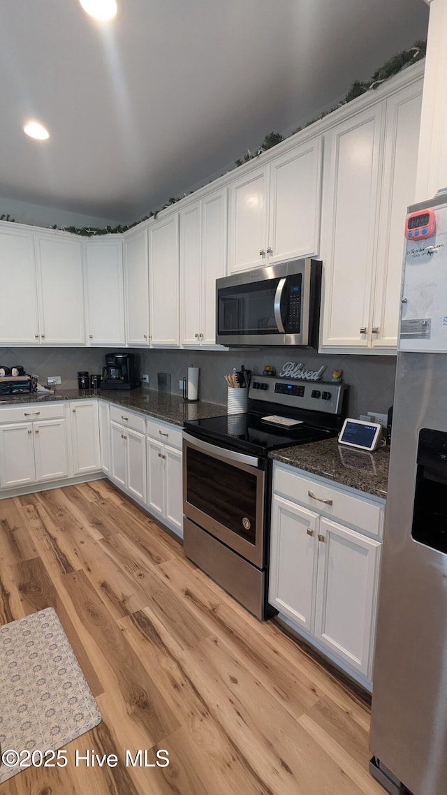 435 Lancaster Dr, Vass, NC 28394 - kitchen with stainless steel appliances, white cabinetry, light wood finished floors, and recessed lighting