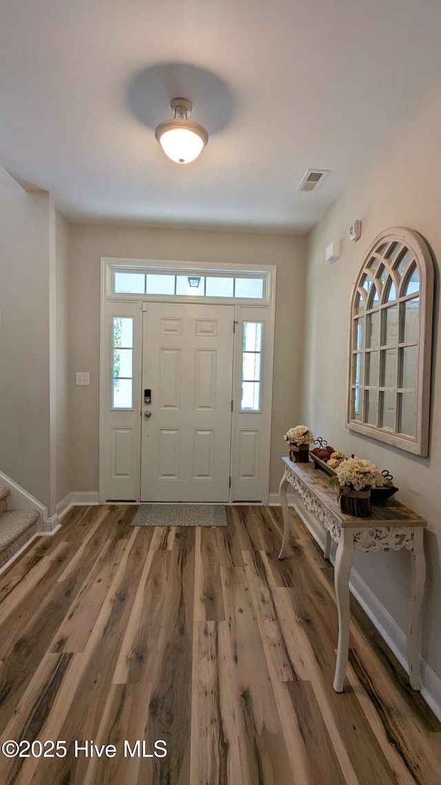 435 Lancaster Dr, Vass, NC 28394 - foyer with plenty of natural light, light wood-style floors, baseboards, and stairs