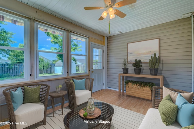 435 Foxfield Ct, Wilmington, NC 28411 - sunroom / solarium with plenty of natural light, wood finished floors, a wooden deck, and wooden walls