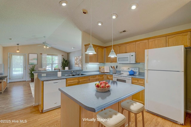 435 Foxfield Ct, Wilmington, NC 28411 - kitchen featuring white appliances, lofted ceiling, light wood-style floors, a peninsula, and a sink