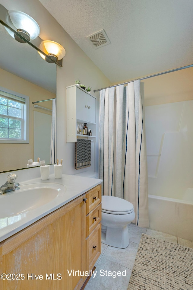 435 Foxfield Ct, Wilmington, NC 28411 - full bath featuring vanity, toilet, tile patterned floors, shower / tub combo, and a textured ceiling
