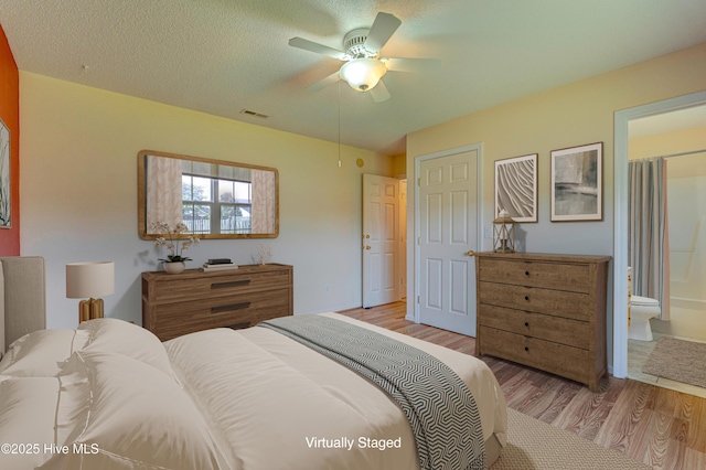 435 Foxfield Ct, Wilmington, NC 28411 - bedroom featuring light wood finished floors, connected bathroom, and a ceiling fan