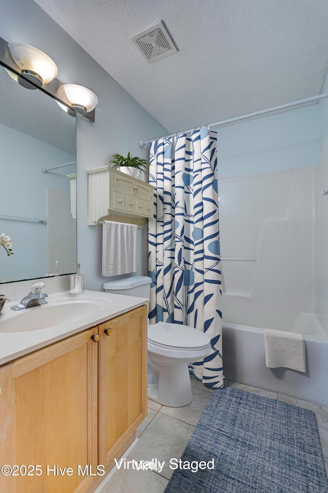 435 Foxfield Ct, Wilmington, NC 28411 - full bathroom with vanity, a textured ceiling, shower / tub combo, toilet, and tile patterned floors