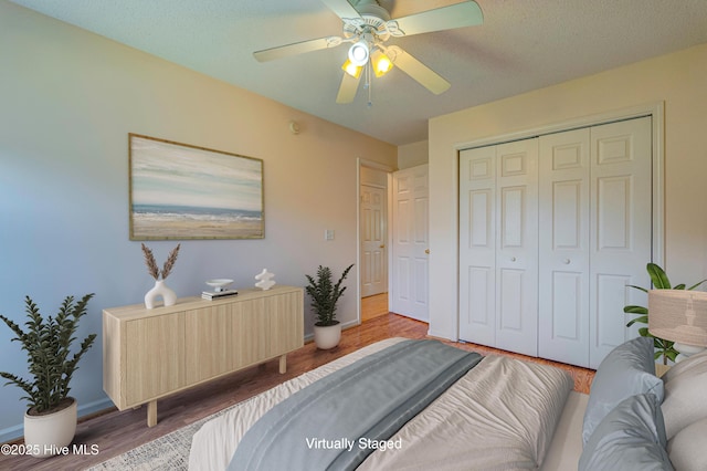 435 Foxfield Ct, Wilmington, NC 28411 - bedroom featuring a closet, wood finished floors, ceiling fan, baseboards, and radiator heating unit