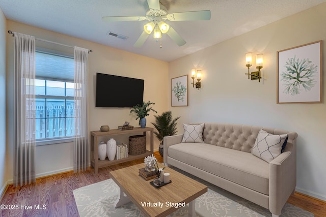 435 Foxfield Ct, Wilmington, NC 28411 - living area featuring ceiling fan, wood finished floors, and baseboards