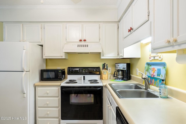 301 E Commerce Way Unit 350, Atlantic Beach, NC 28512 - kitchen featuring ventilation hood, electric range, freestanding refrigerator, black microwave, and white cabinets