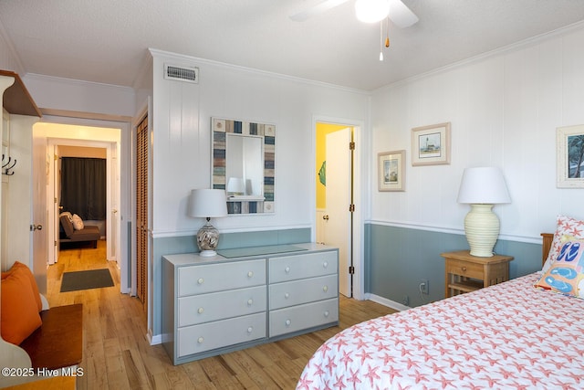 301 E Commerce Way Unit 350, Atlantic Beach, NC 28512 - bedroom featuring crown molding, wood finished floors, and a closet
