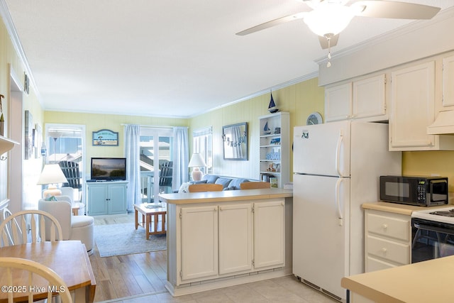 301 E Commerce Way Unit 350, Atlantic Beach, NC 28512 - kitchen featuring white appliances, open floor plan, crown molding, a peninsula, and light countertops