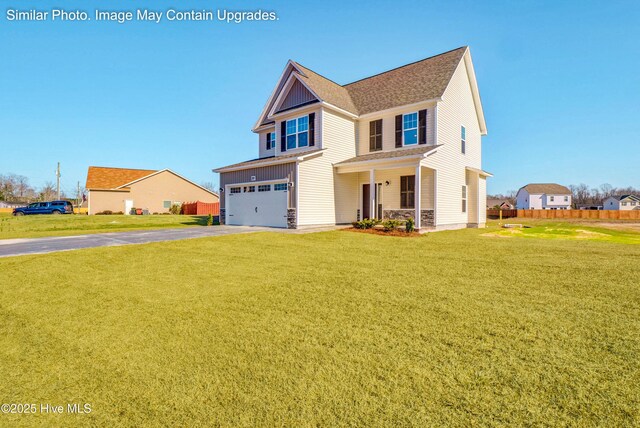 129 Tides End Dr Lot 34, Holly Ridge, NC 28445 - view of front of home with asphalt driveway, a garage, a porch, and stone siding