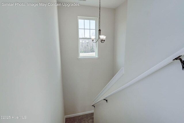 129 Tides End Dr Lot 34, Holly Ridge, NC 28445 - stairs with a chandelier, carpet flooring, and baseboards