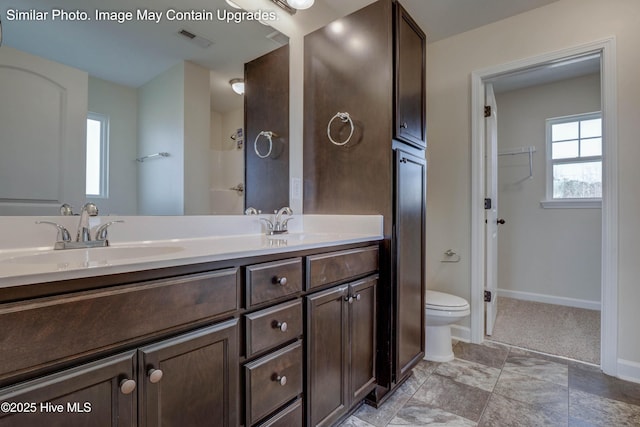 129 Tides End Dr Lot 34, Holly Ridge, NC 28445 - bathroom featuring double vanity, toilet, and baseboards