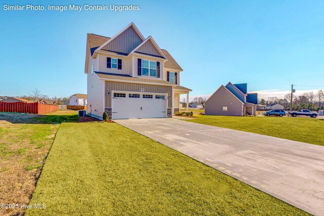 129 Tides End Dr Lot 34, Holly Ridge, NC 28445 - craftsman-style house featuring board and batten siding, a garage, concrete driveway, central AC, and stone siding