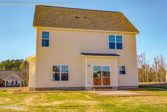 129 Tides End Dr Lot 34, Holly Ridge, NC 28445 - back of property featuring a lawn, a patio area, and roof with shingles
