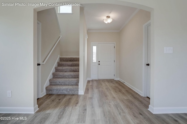 129 Tides End Dr Lot 34, Holly Ridge, NC 28445 - foyer with arched walkways, stairs, wood finished floors, ornamental molding, and baseboards