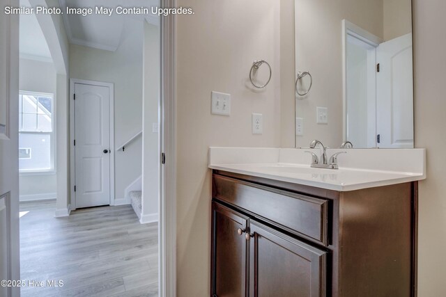 129 Tides End Dr Lot 34, Holly Ridge, NC 28445 - bathroom featuring vanity, wood finished floors, crown molding, and baseboards