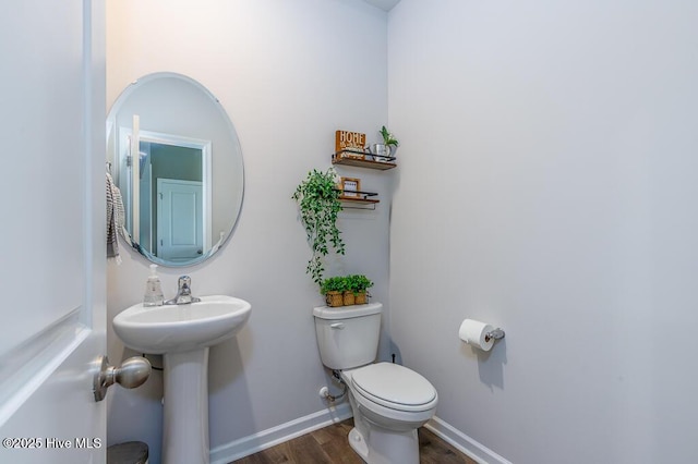 106 Featherstone Ln, New Bern, NC 28562 - bathroom featuring wood finished floors, toilet, and baseboards