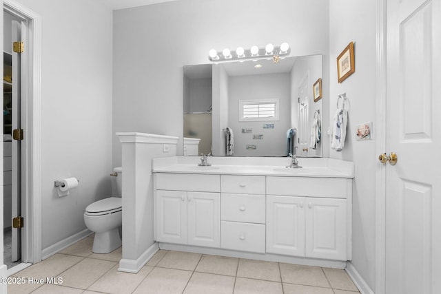 4156 Buckingham Ct, Southport, NC 28461 - bathroom with double vanity, tile patterned flooring, toilet, and baseboards