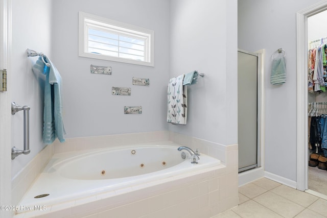 4156 Buckingham Ct, Southport, NC 28461 - bathroom featuring a whirlpool tub, a shower stall, tile patterned floors, and a walk in closet