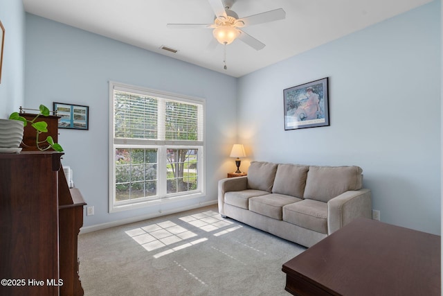 4156 Buckingham Ct, Southport, NC 28461 - living room featuring a ceiling fan, carpet floors, and baseboards