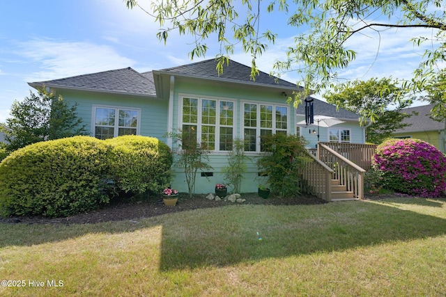 4156 Buckingham Ct, Southport, NC 28461 - view of front of property with a front yard, crawl space, roof with shingles, and a deck