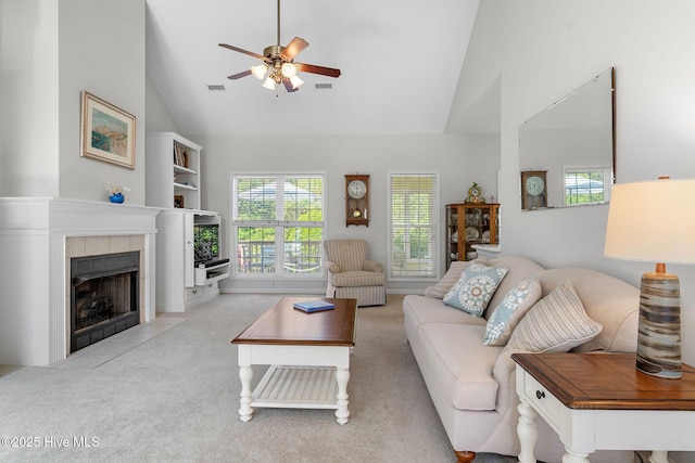 4156 Buckingham Ct, Southport, NC 28461 - living area with high vaulted ceiling, a ceiling fan, healthy amount of natural light, carpet, and a fireplace