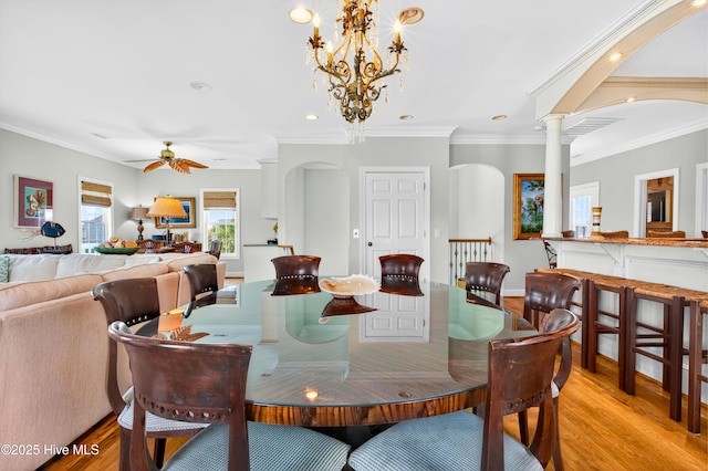 1510 N Shore Dr, Sunset Beach, NC 28468 - dining room featuring light wood-type flooring, arched walkways, a ceiling fan, ornamental molding, and recessed lighting