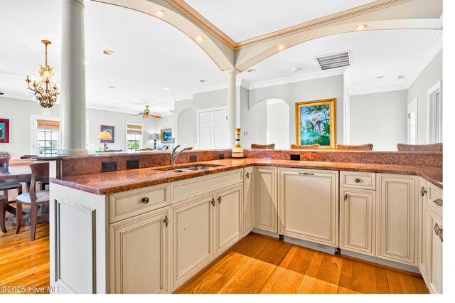 1510 N Shore Dr, Sunset Beach, NC 28468 - kitchen with cream cabinetry, open floor plan, a ceiling fan, light wood-style floors, and recessed lighting