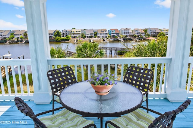 1510 N Shore Dr, Sunset Beach, NC 28468 - balcony with a residential view, a deck with water view, and outdoor dining space