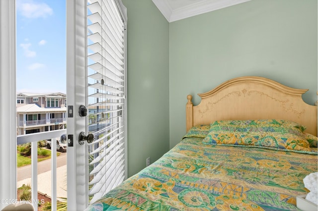 1510 N Shore Dr, Sunset Beach, NC 28468 - bedroom featuring ornamental molding and multiple windows