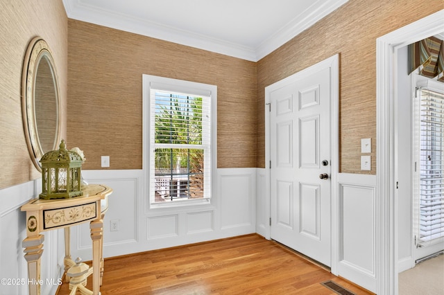 1510 N Shore Dr, Sunset Beach, NC 28468 - entryway featuring light wood finished floors, wainscoting, and crown molding