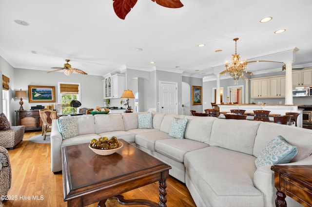 1510 N Shore Dr, Sunset Beach, NC 28468 - living area with ceiling fan, recessed lighting, a chandelier, light wood finished floors, and crown molding